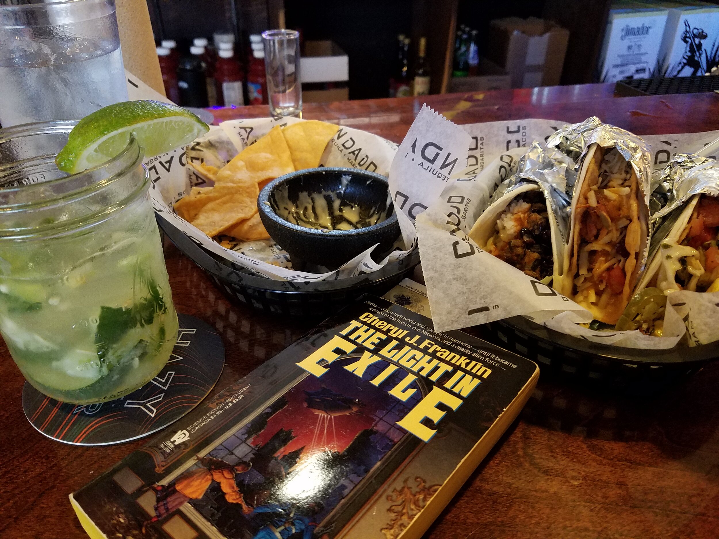 Reading The Light in Exile at a taco restaurant